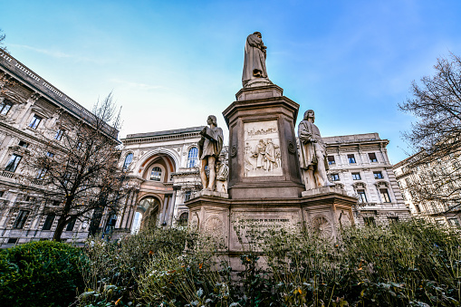Side Low Angle View Of Leonardo Da Vinci Monument At Piazza Della Scala In Milan, Italy