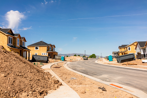 Construction progress on a group of houses along a new street south of Salt Lake City in Utah, USA.