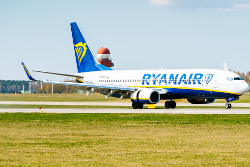 Boeing 737 of Ryanair airlines taxiing towards terminals in Gdansk Lech Wałęsa international airport.