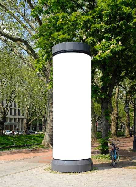 empty advertising pillar in a city with free copy space, promotion mockup