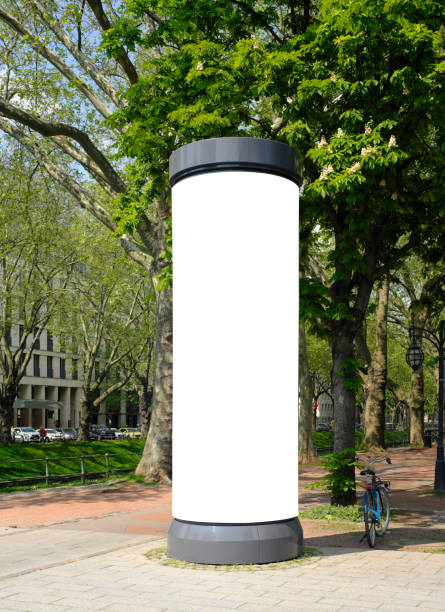 empty advertising pillar in a city with free copy space, promotion mockup stock photo