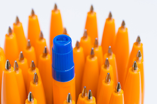 Yellow ballpoint pens close up. Stationery for writing in the office.