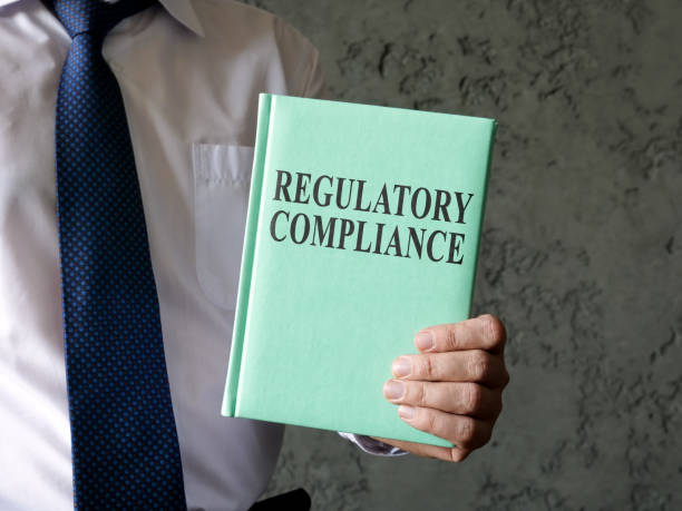 istock A man propose book about regulatory compliance. 1394993161