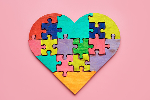 A Heart from colored puzzle pieces. Autism concept.