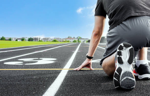 istock Man athlete at ready position for running 1394993398
