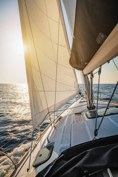 istock Sailing with sailboat at sunset 1394993431