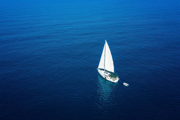 Sailboat during sailing. High angle view from drone.