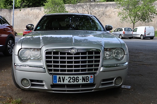 Chrysler 300 C CRD, metallic gray luxury sedan car, city of Bourges, Cher department, France