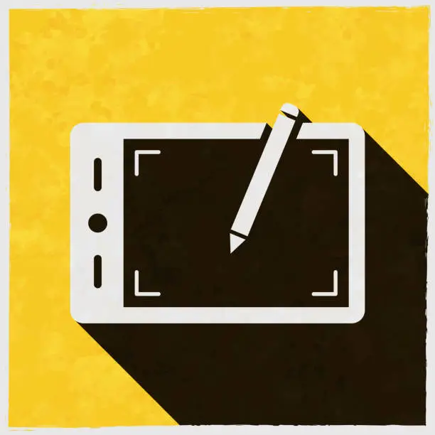 Vector illustration of Graphic tablet. Icon with long shadow on textured yellow background