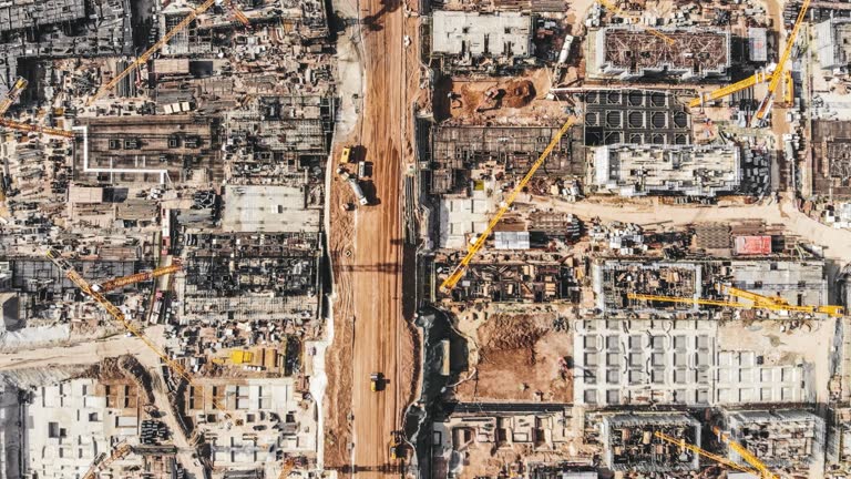 T/L PAN Aerial View of Working Construction Site