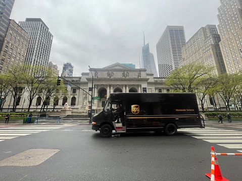 New York, NY  USA - May 2, 2022: New York City, Delivery Truck in Front of The New York Public Library in Midtown Manhattan