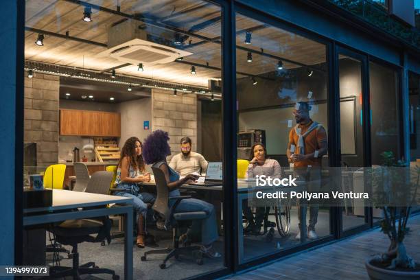 People Working In Creative Office At Night Stock Photo - Download Image Now - Office, Technology, Innovation