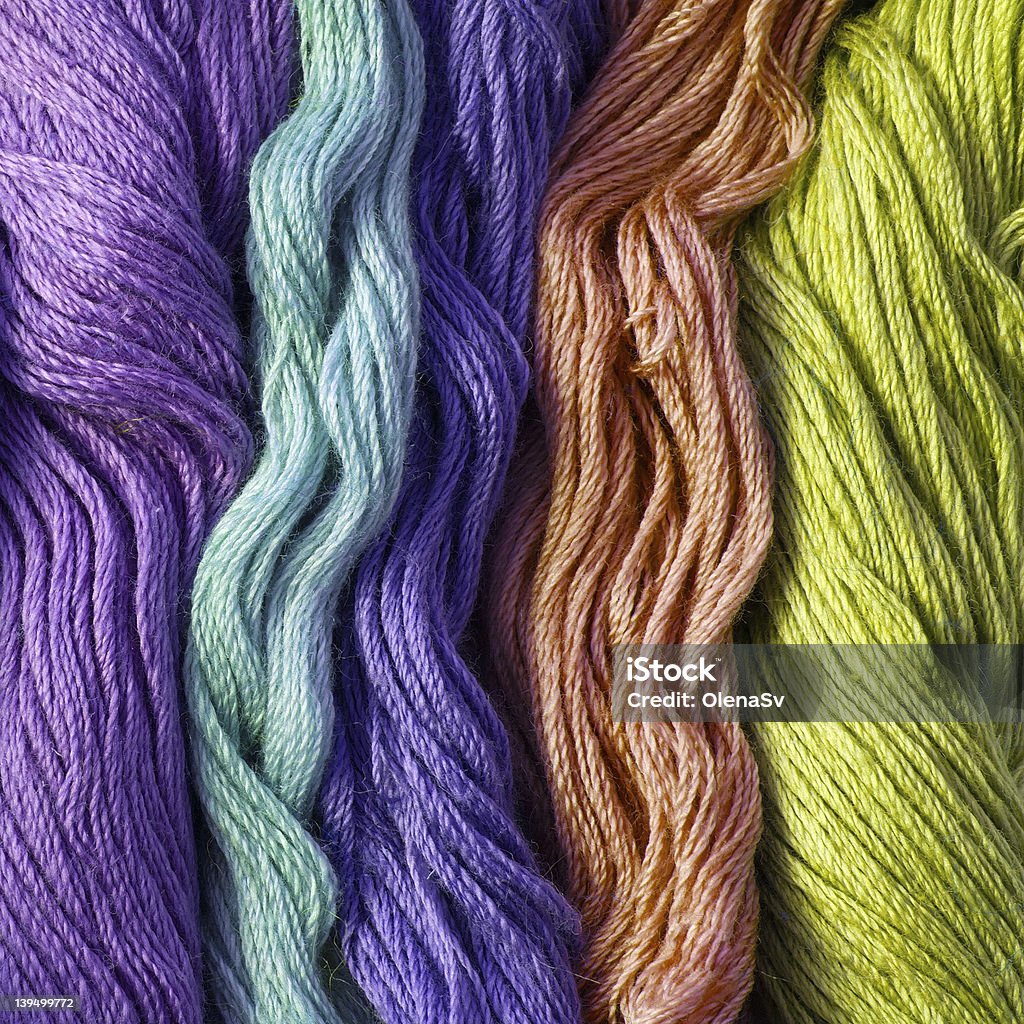 Fondo filato ricamo in vari colori - Foto stock royalty-free di Blu