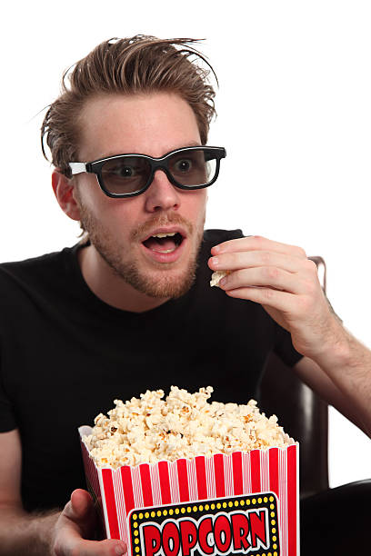 istock Amazed man in 3D-glasses with a popcorn bucket. 139499831