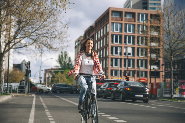 istock Young woman cycling in Berlin 1394998823