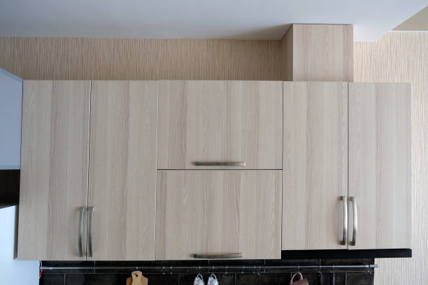 istock Built-in beige kitchen doors with metal handles. 1395000059