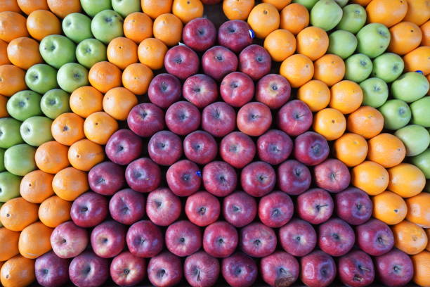 istock geometrically arranged red apples, oranges and green apples 1395001106