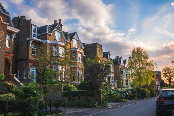 View of traditional residential street in Wimbledon, England, at sunset View of traditional residential street in Wimbledon, England, at sunset wimbledon stock pictures, royalty-free photos & images