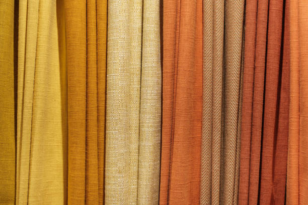 Background Texture Of A Selection Of Multiple Different Warm-Colored Fabric Samples