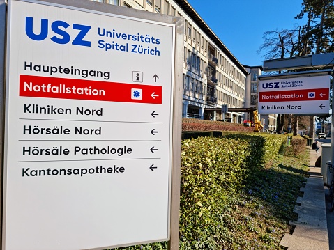 University Hospital of Zürich (USZ) with some information signs. The image shows the main entrance to the University Hospital. It is one of the largest hospitals in switzerland and more thean 8'000 Employees are working for it.