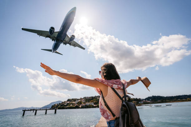istock Young Female Tourist Spreading Her Arms 1395008634