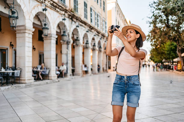 istock Young Female Tourist Photographing Monuments 1395010128
