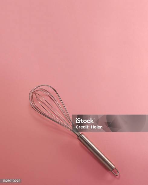 Steel Whisk Flat Lay Top View Confectionery Cooking Concept With Copy Space On Bright Pink Paper Background Stock Photo - Download Image Now