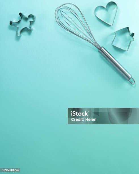 Steel Whisk House Men And Heart Shaped Cutter Flat Lay Top View Confectionery Cooking Concept With Copy Space On Bright Cyan Paper Background Stock Photo - Download Image Now
