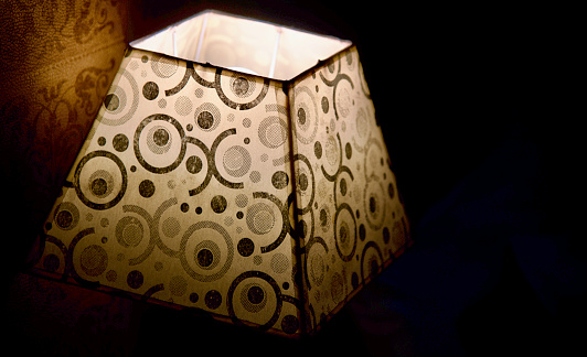 Traditional electric lamp shades at night unique stock photo