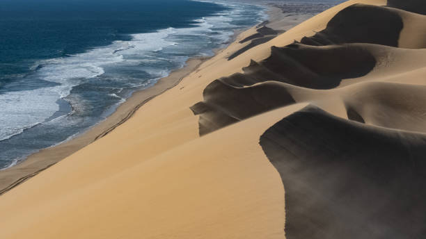 istock Namibia, the Namib desert, falling into the sea 1395014612