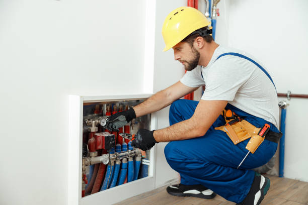 istock Serious technician, plumber in uniform checking water consumption, pipes and meter counter in apartment 1395015862