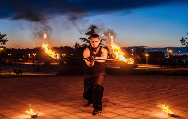 Fire Playing Video 300+ Fire Blowing Art Flame Stock Photos, Pictures & Royalty-Free ...