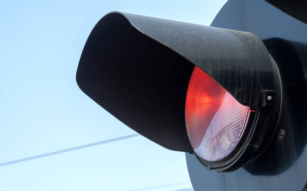 istock Rail crossing red warning light, train crossing railroad station safety signal light object detail, closeup, nobody no people. Simple rail transportation safety symbol abstract concept, rail transport 1395019691