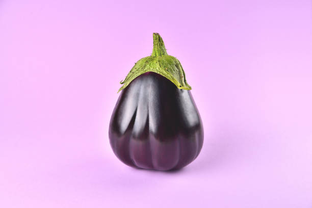 istock Eggplant on a purple background, fresh juicy vegetable on a colored background, selective focus, soft focus 1395021913
