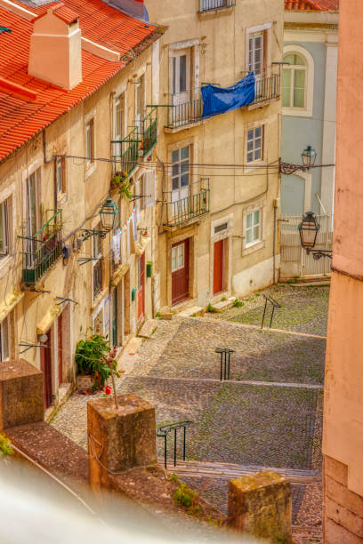 istock romantic narrow streets of Lisbon old town 1395024607