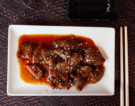 Japanese style veal meat braised in wok with soy sauce and sesame
