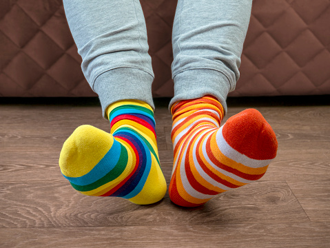Strange Socks Day. Lonely Sock Day. The social problem of bullying. Strange socks as a symbol of Down syndrome.Odd Socks Day. Lonely Sock Day. The social problem of bullying. Strange socks as a symbol of Down syndrome.