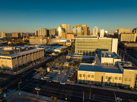 Aerial shot of Downtown Phoenix, Arizona at sunset. \n\nAuthorization was obtained from the FAA for this operation in restricted airspace.