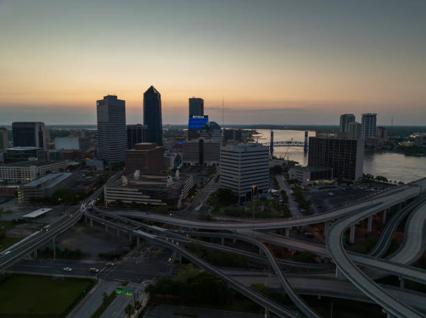istock Freeway Interchange and Jacksonville Skyline at Dawn - Aerial 1395029447