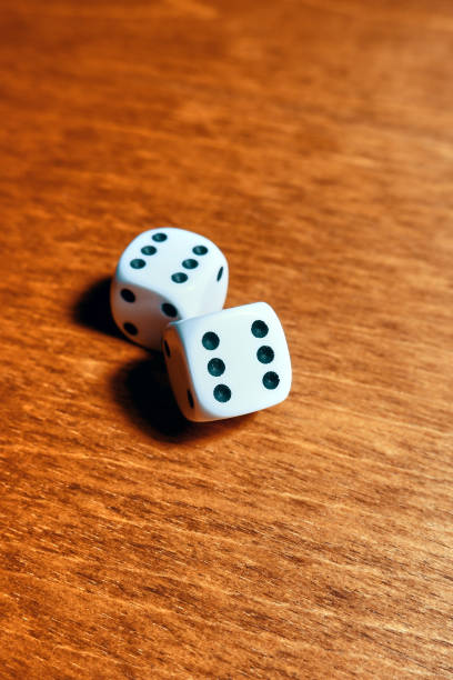istock Close-up of two dice with rolled sixes 1395029769