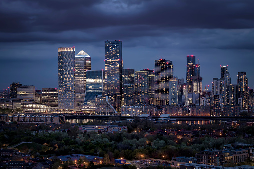 Elevated view of the skyscrapers at the financial district Canary Wharf, London, Docklands during evening time