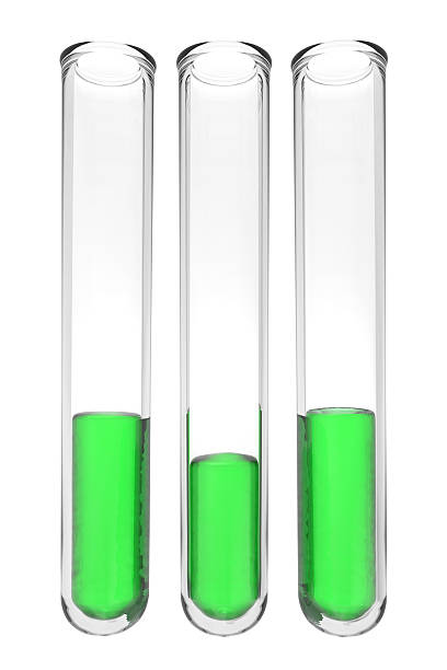 three testt ubes with green liquids on white background