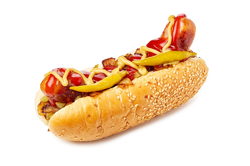 Hotdog with thick sausage, fried onion and pickled peppers isolated on white background. Clipping path included