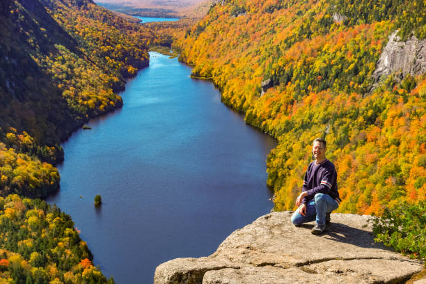 istock Hiker Adirondacks USA Cliff Lake 1395044726