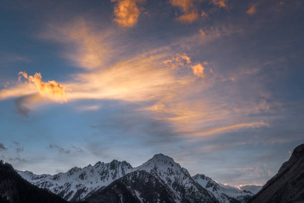 Sunset on a snowy mountain stock photo