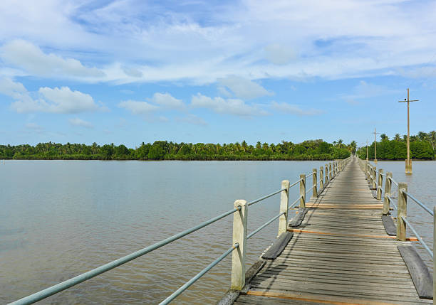 istock Long wood bridge over a river 139504999
