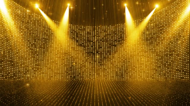The golden particle spotlight shines on the flashing stage background
