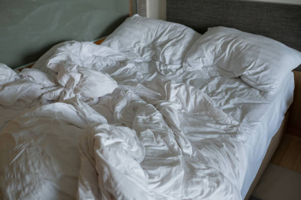 istock white bed background, after sleep, dirty bed 1395054346