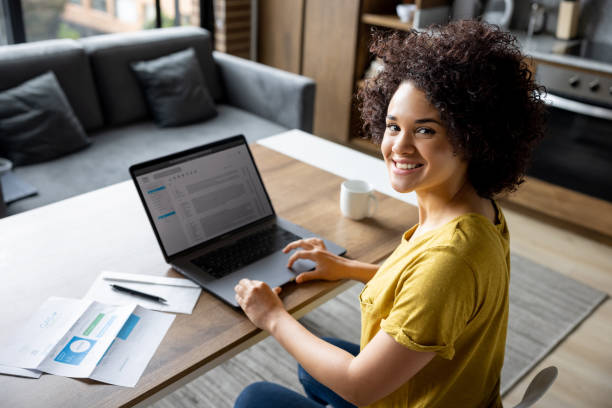 istock Happy woman working at home and checking her e-mail 1395058260