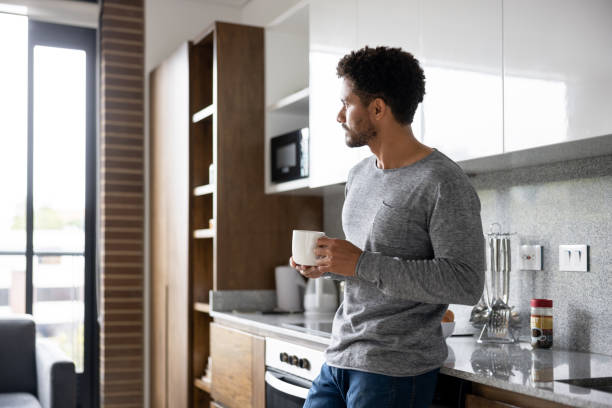 istock Man at home taking a break and drinking a cup of coffee 1395058317